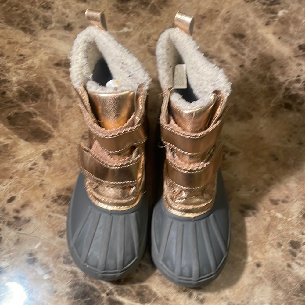 Gray and gold play boots